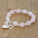 UNICEF Market | Rose Quartz Beaded Bracelet with Heart Charms from .