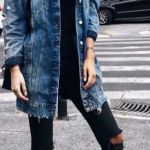 this oversized distressed denim jacket paired with frayed black .
