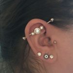 Tragus industrial lobe piercing rose gold Freaky's Tattoo .