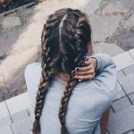 Two French Braids on Long Brown Hair with Subtle Lighter Streaks .