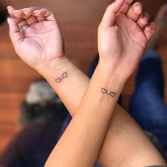 Matching heart tattoos on the wrist | www.otziapp.com | Tattoos .