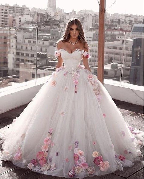 Ballgown wedding dress with floral appliques. Click for even more .