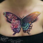 Stunning butterfly tattoo on chest by Levgen | Feminine tattoos .