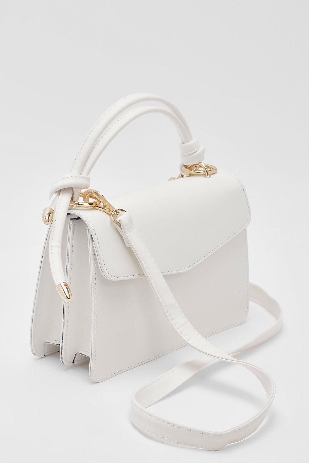 Add stylish white handbags to your
fashion collection