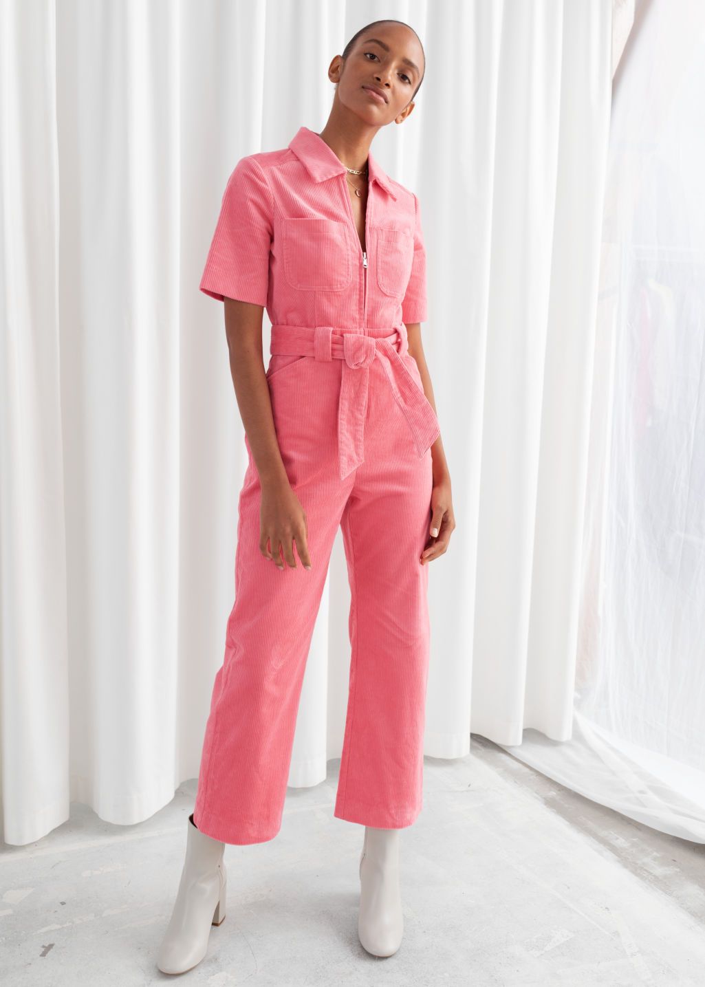 The childlike look in a pink jumpsuit