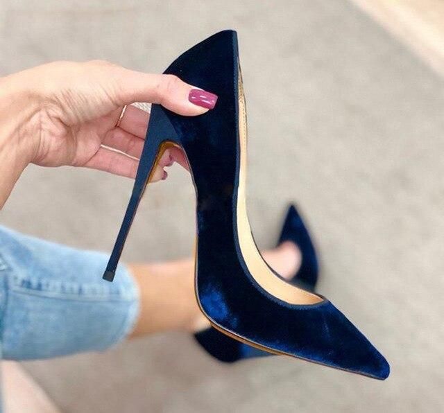 Acquire the world with navy high heels