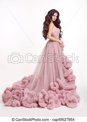 Beautiful woman in luxury lush pink dress. fashion lady brunette .