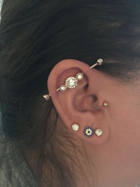 Tragus industrial lobe piercing rose gold Freaky's Tattoo .