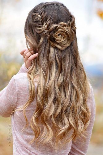 boho wedding hairstyles half up half down with flower-shaped bun .