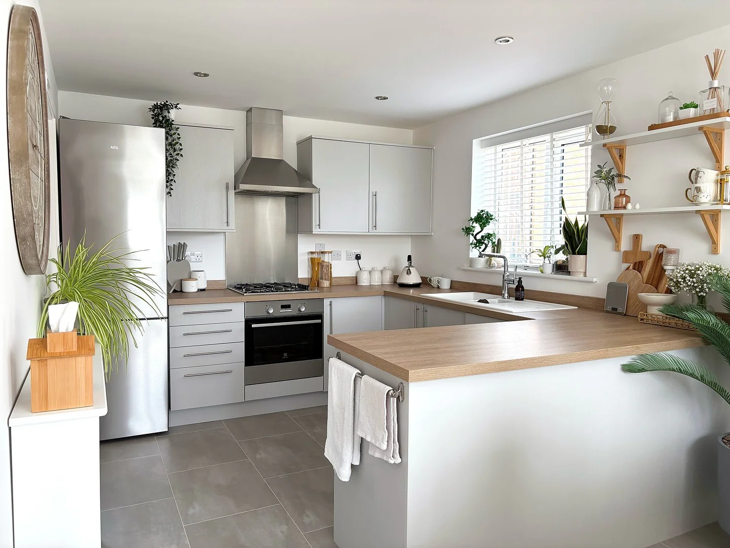 Subtle Grey Flooring with Light Wood and White Cabinets