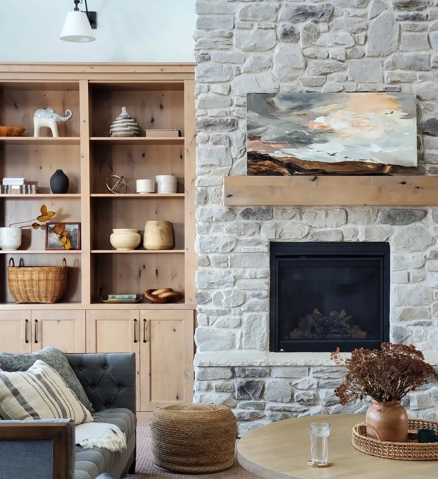 Gentle Rustic Charm with Soft Neutral Shades (Stone Fireplace Living Room Ideas)