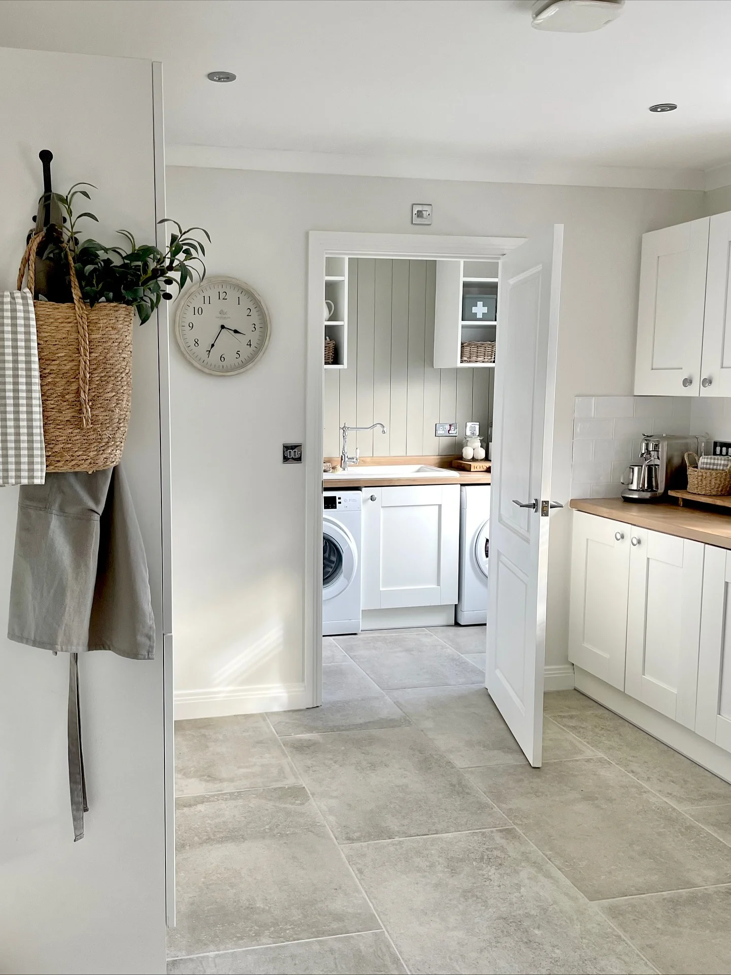 Seamless Grey Tiles Linking Kitchen and Utility Areas