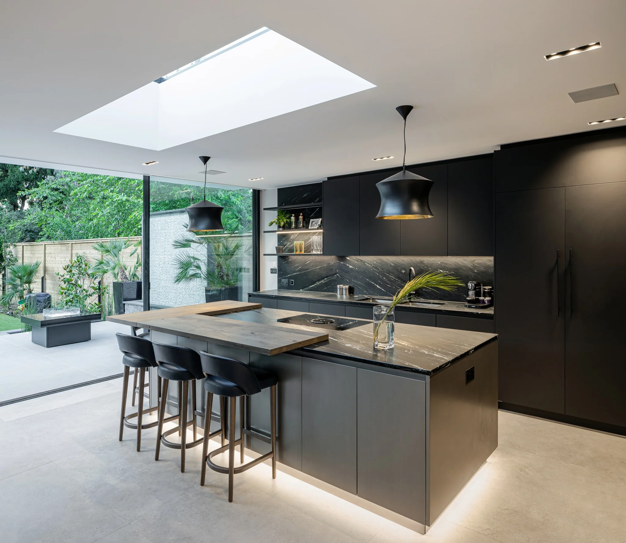 Dark Grey Flooring with Matte Black Cabinets for a Modern Edge