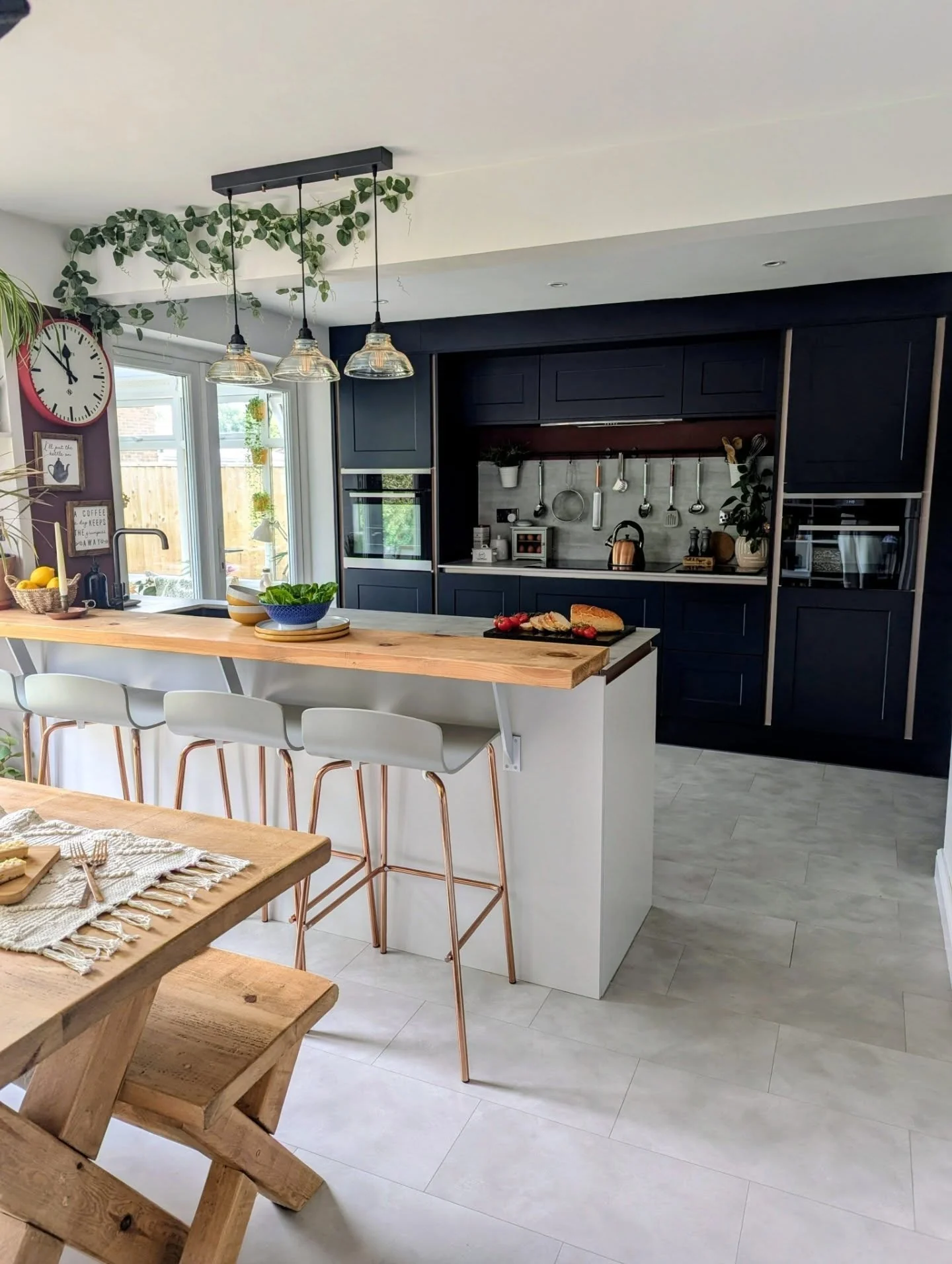 Light Grey Flooring Complementing Navy and Warm Wood