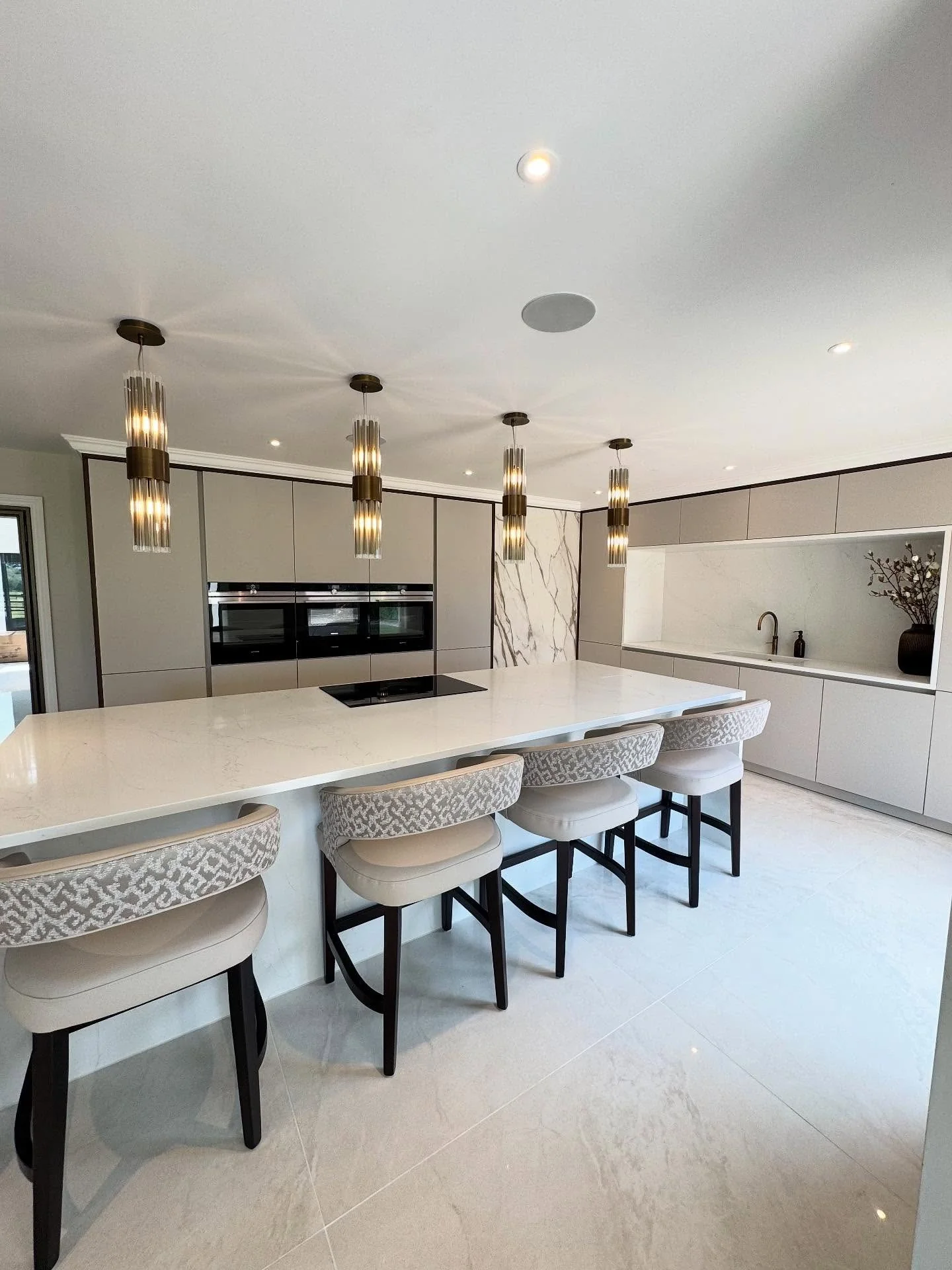 Polished Grey Tiles Elevating a Modern Neutral Kitchen