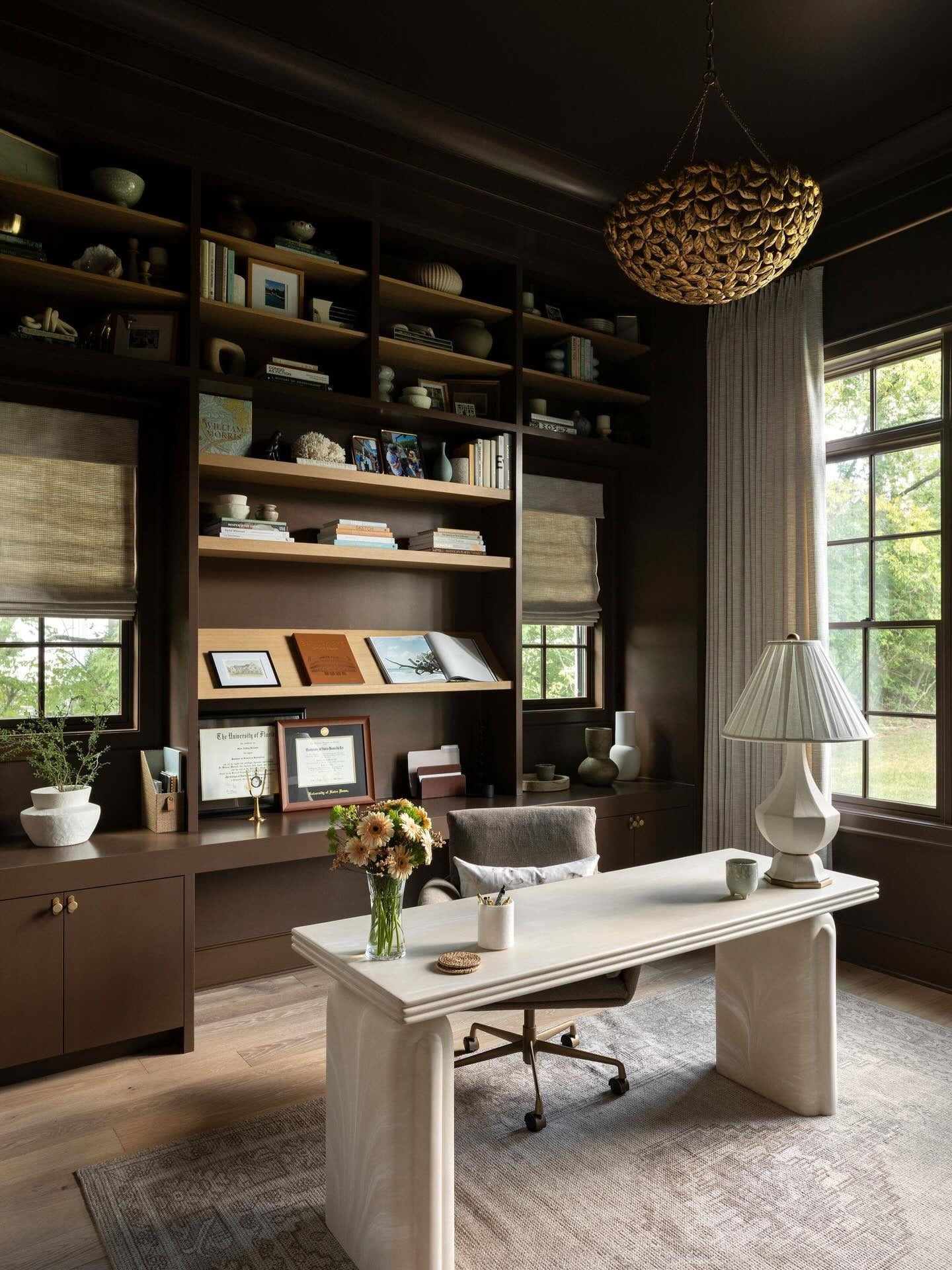 Chocolate Brown Office with Custom Shelving and Cream Desk