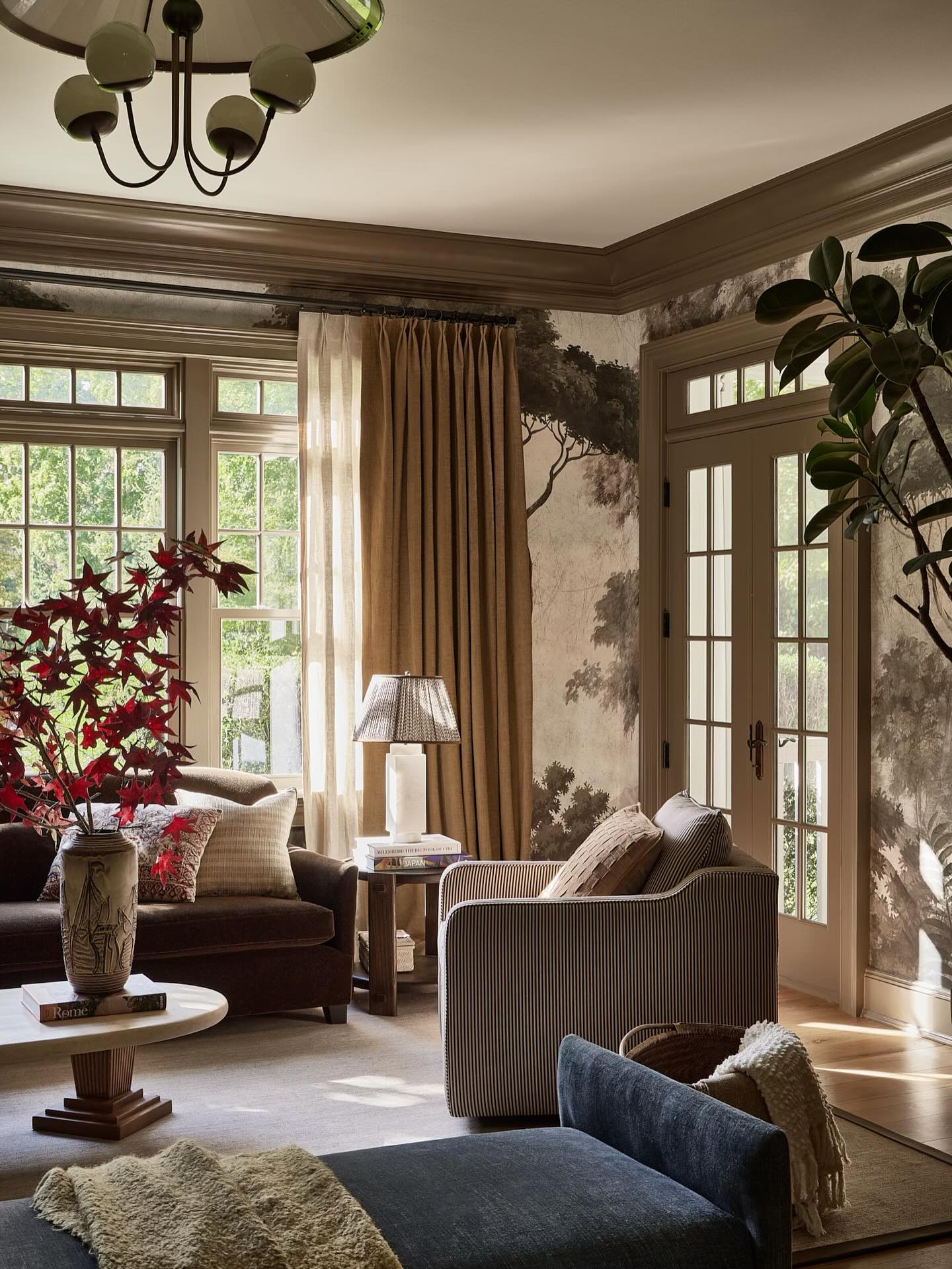 Nature-Inspired Sitting Room with Artistic Wall Murals