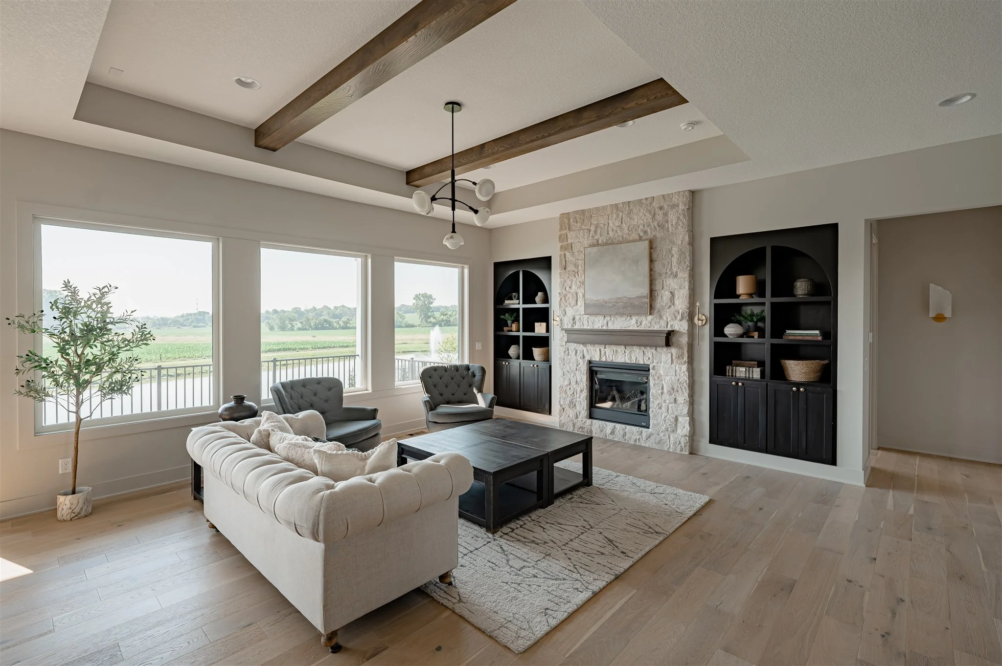 Classic Contemporary Room with Creamy Stone Accents (Stone Fireplace Living Room Ideas)