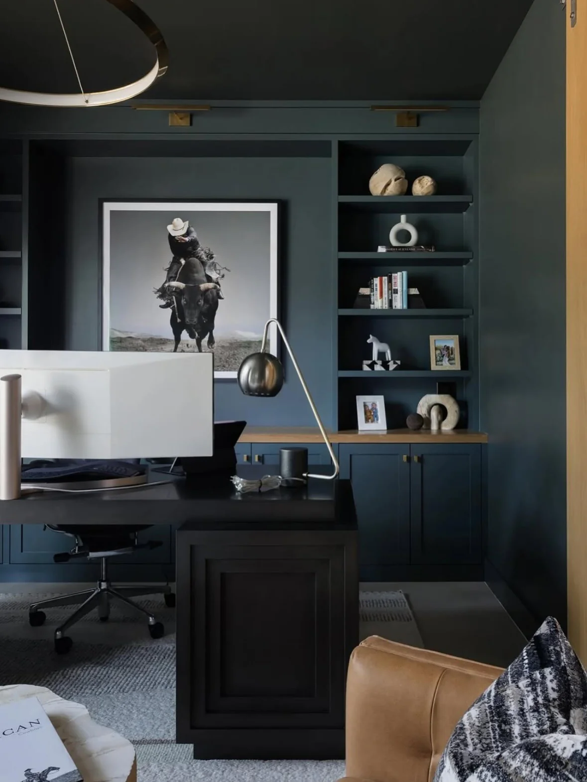Deep Blue Cabinets Complemented by a Solid Black Desk