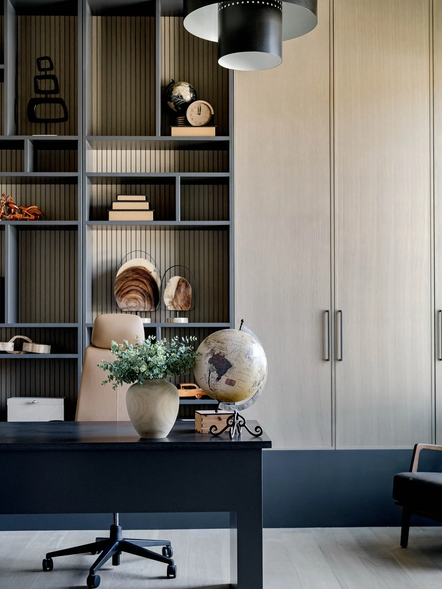 Minimalist Black Desk Against Soft Grey Cabinetry