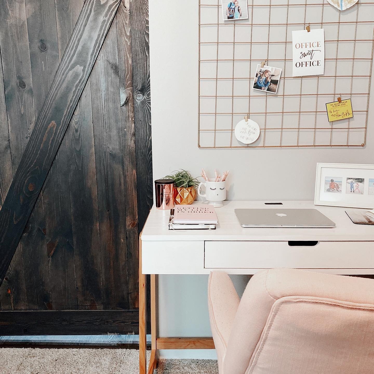 Compact Desk with Blush Tones and Functional Grid Wall (Tiny Home Office Ideas)