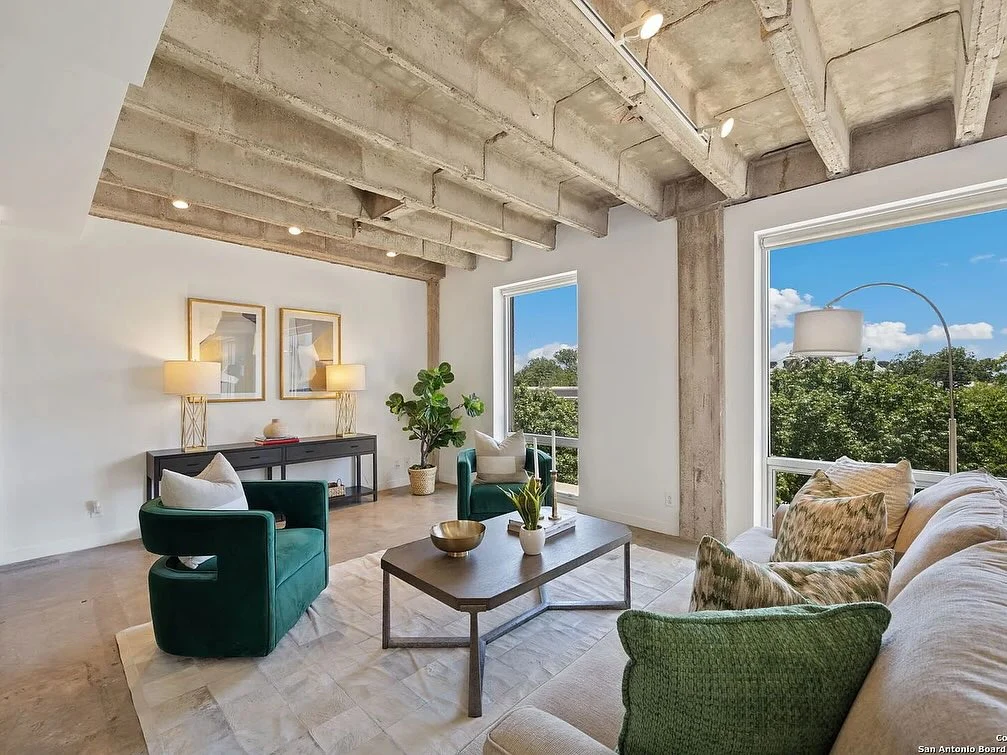 Industrial-Chic Loft Featuring Emerald Seating (Urban Living Room Ideas)