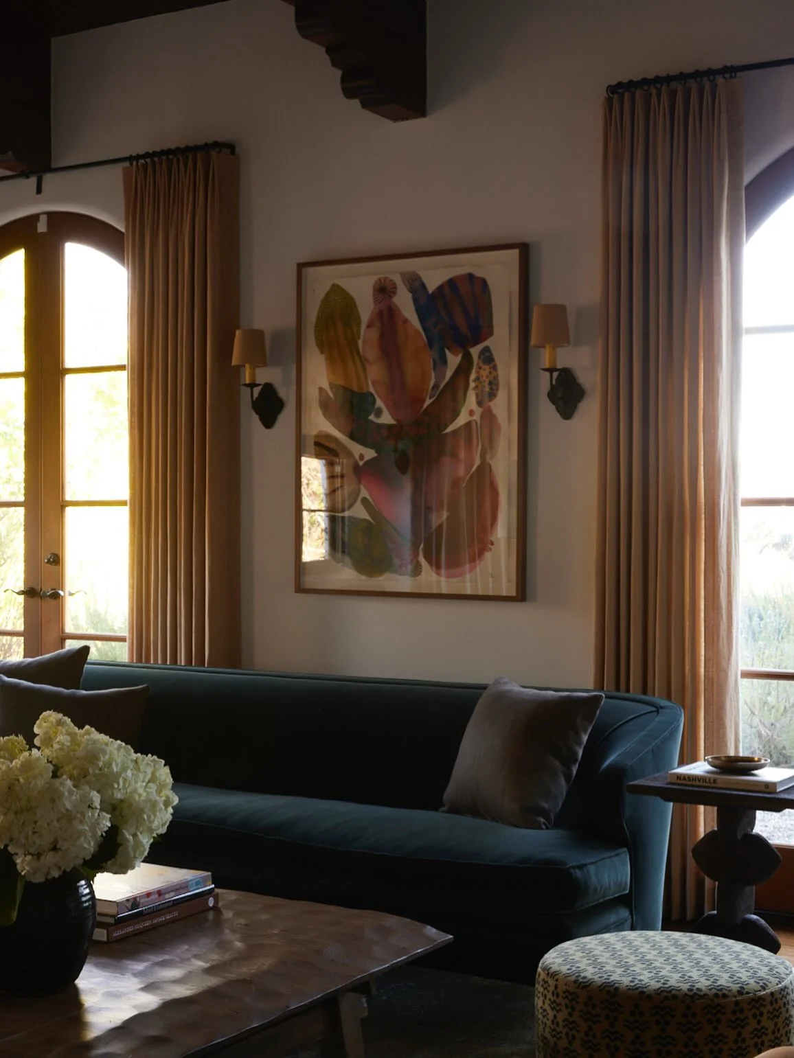 3. Softly Shadowed Neutrals with Deep Green Seating (Masculine Living Room Ideas)