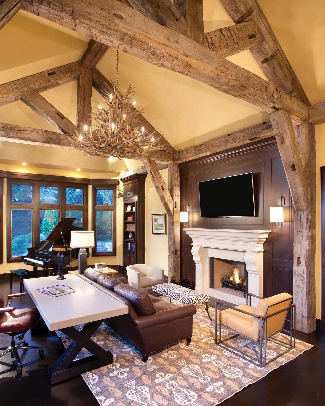 Lodge-Style Workspace with Antler Chandelier and Timber Beams (Rustic Office Ideas)