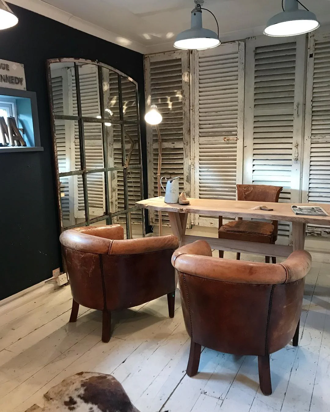 Weathered Shutter Wall with Leather Club Chairs (Rustic Office Ideas)