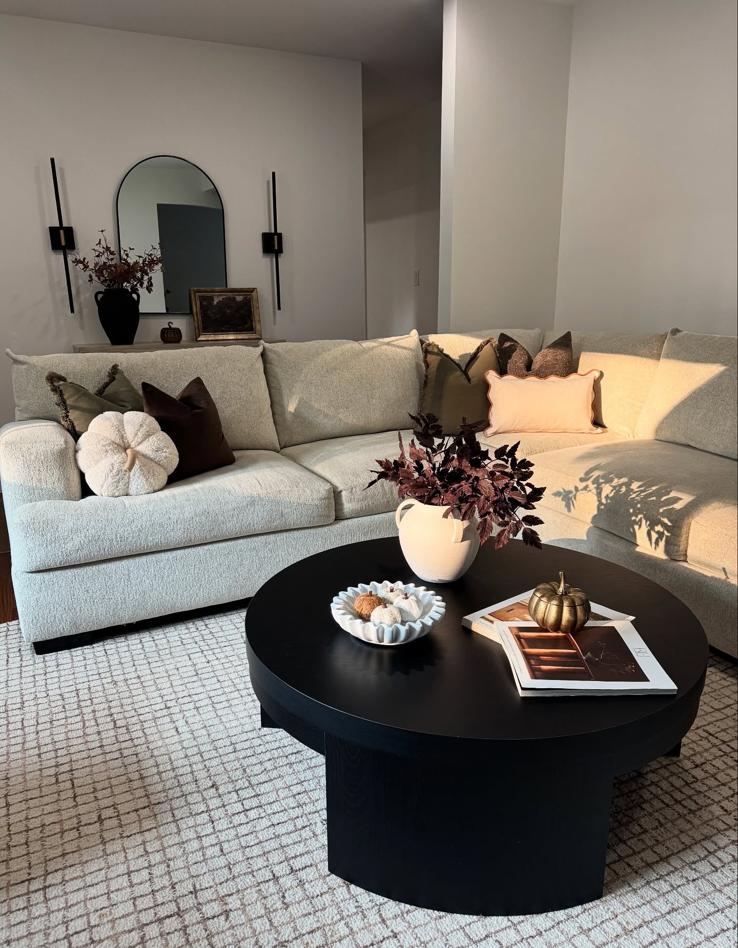 Contemporary Living Room with Black Coffee Table and Gold Decor