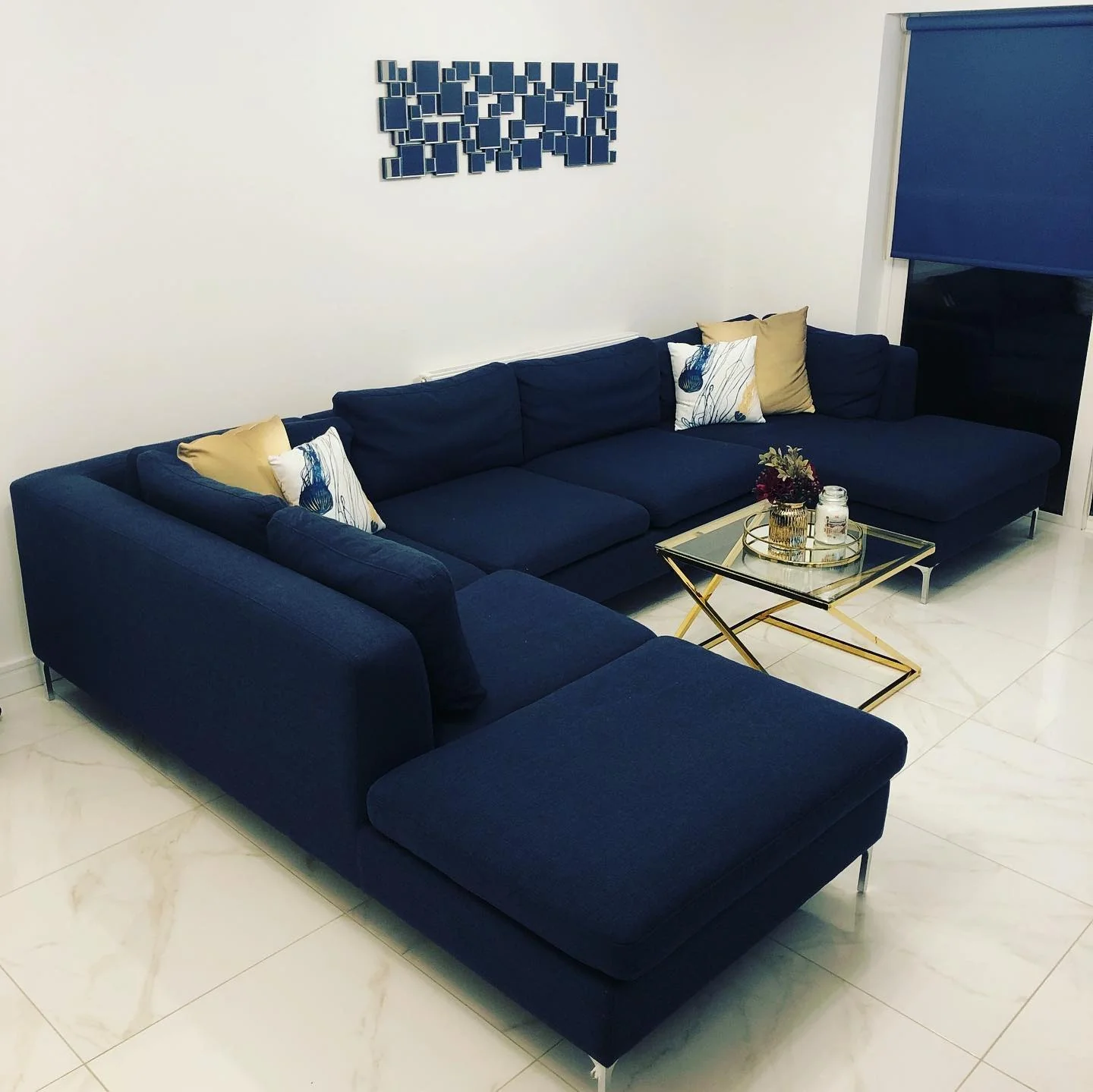 Minimalist Impact with Sculptural Forms and Royal Blue Upholstery