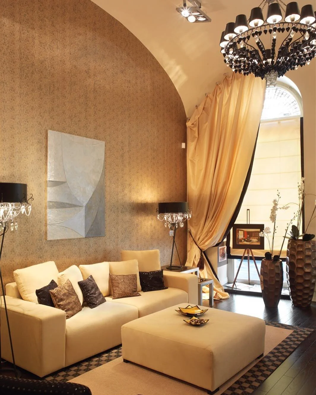 Living Room with Gold Wallpaper and Curved Furniture