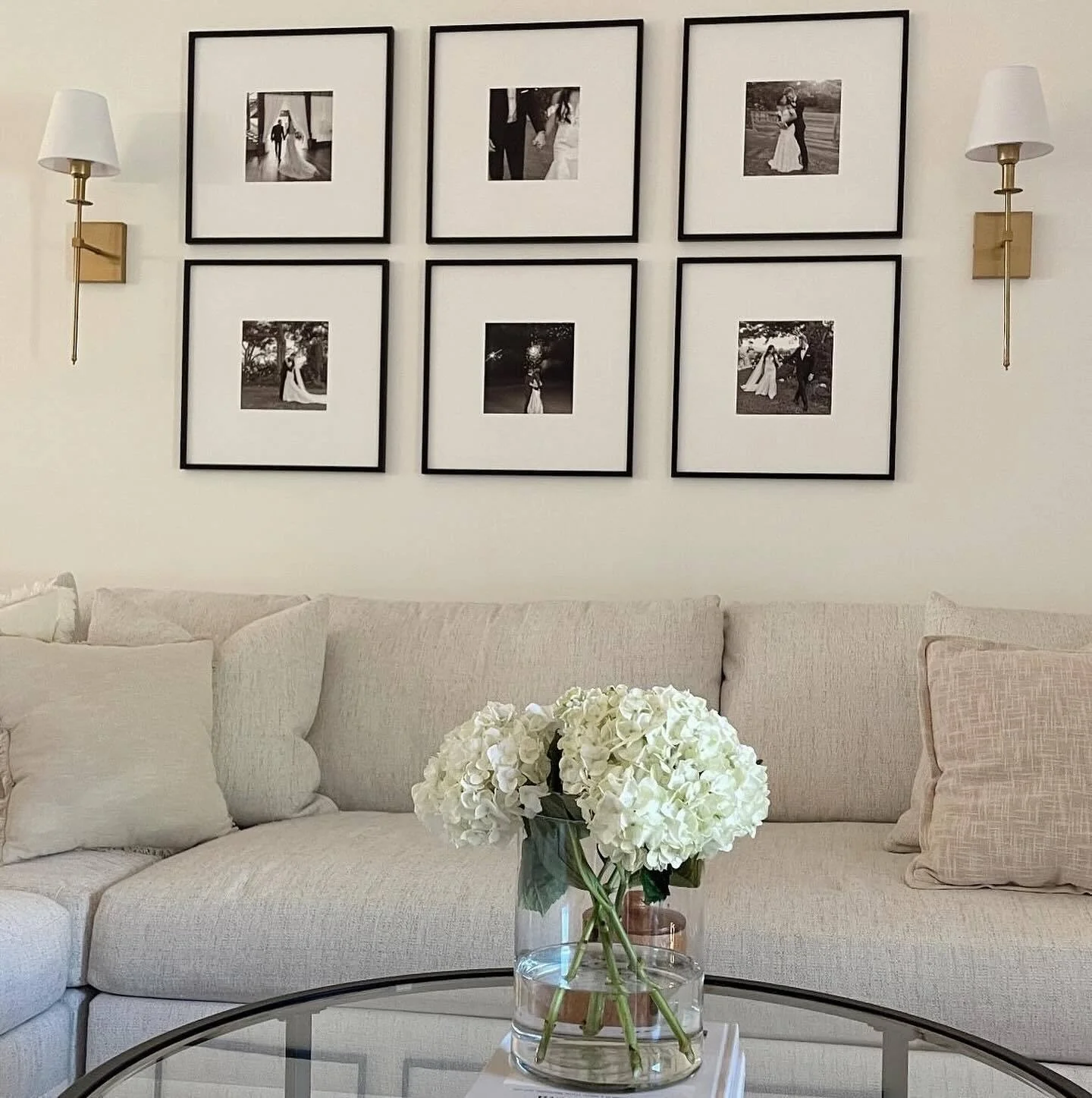 Monochrome Elegance in a Minimalist Grid (Gallery Wall Living Room Ideas)