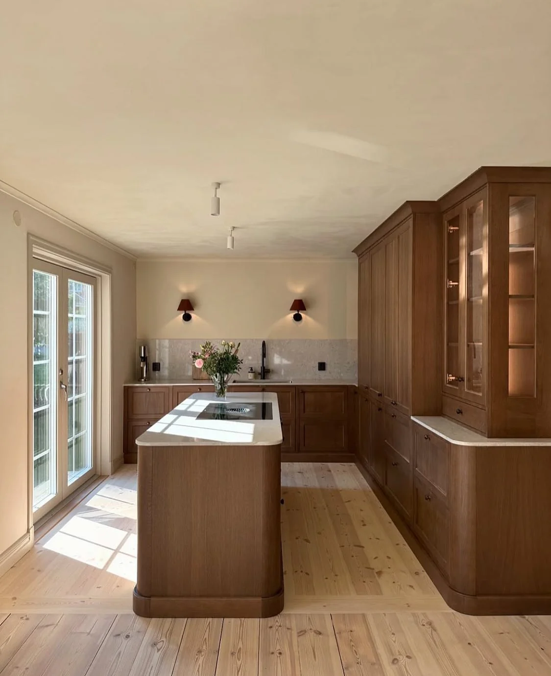 Contemporary kitchen with light-stained oak cabinets