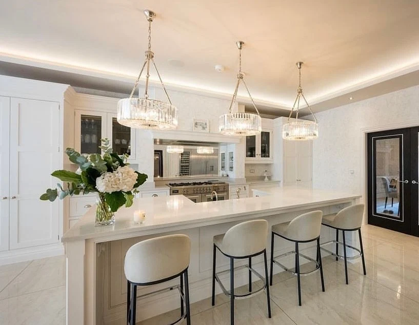 Elegant All-White Kitchen with Crystal Chandeliers