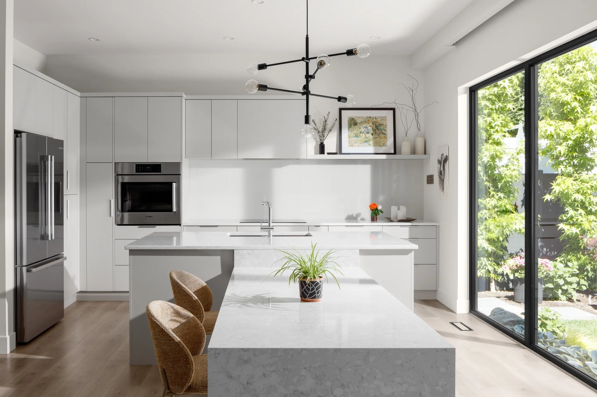 Light-Filled Kitchen with Waterfall Island and Midcentury Flair