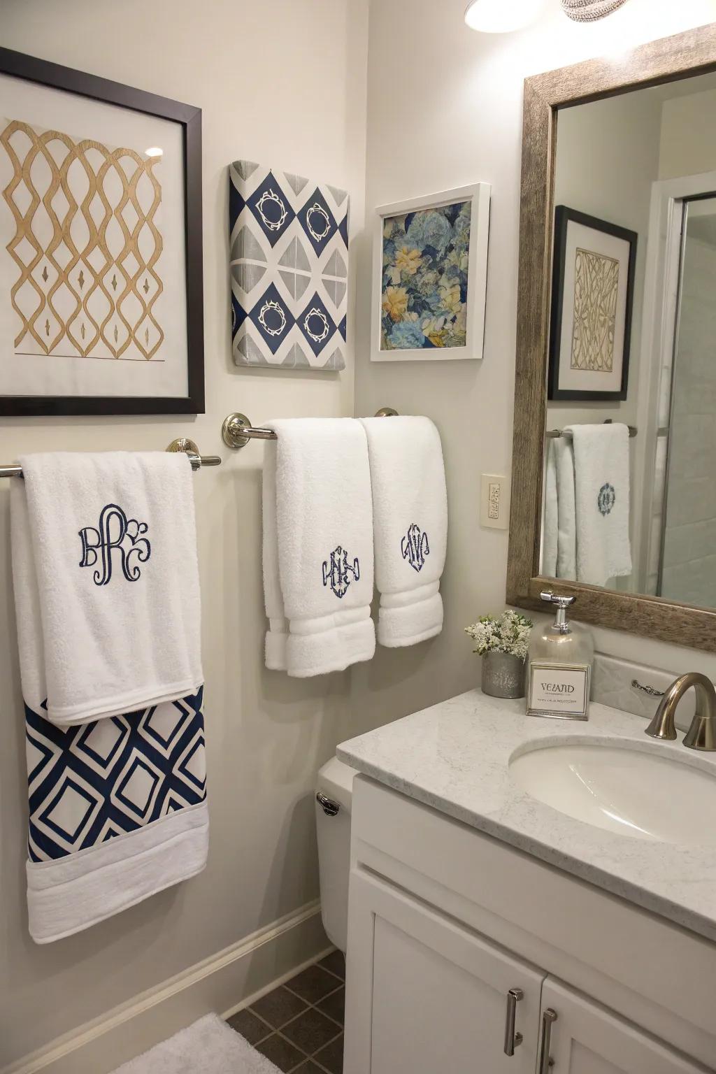 A bathroom with personal accents including monogrammed towels and bespoke art.