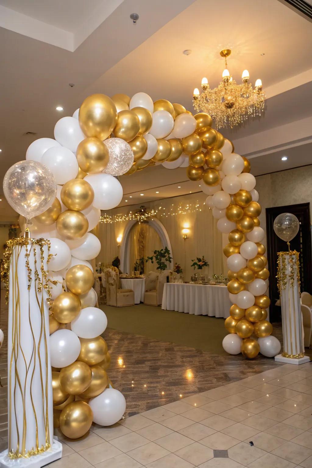 A gorgeous gold balloon arch makes for a perfect entryway into a birthday celebration.