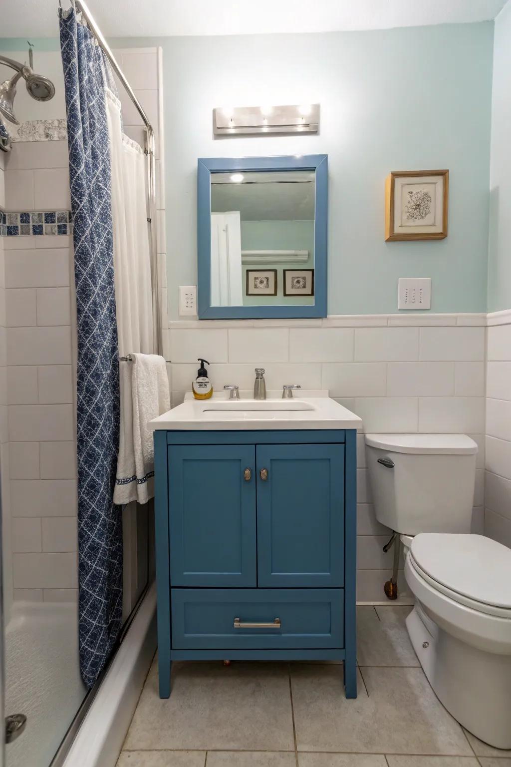 A modern blue vanity distinguishes itself as a centerpiece in this stylish bathroom.