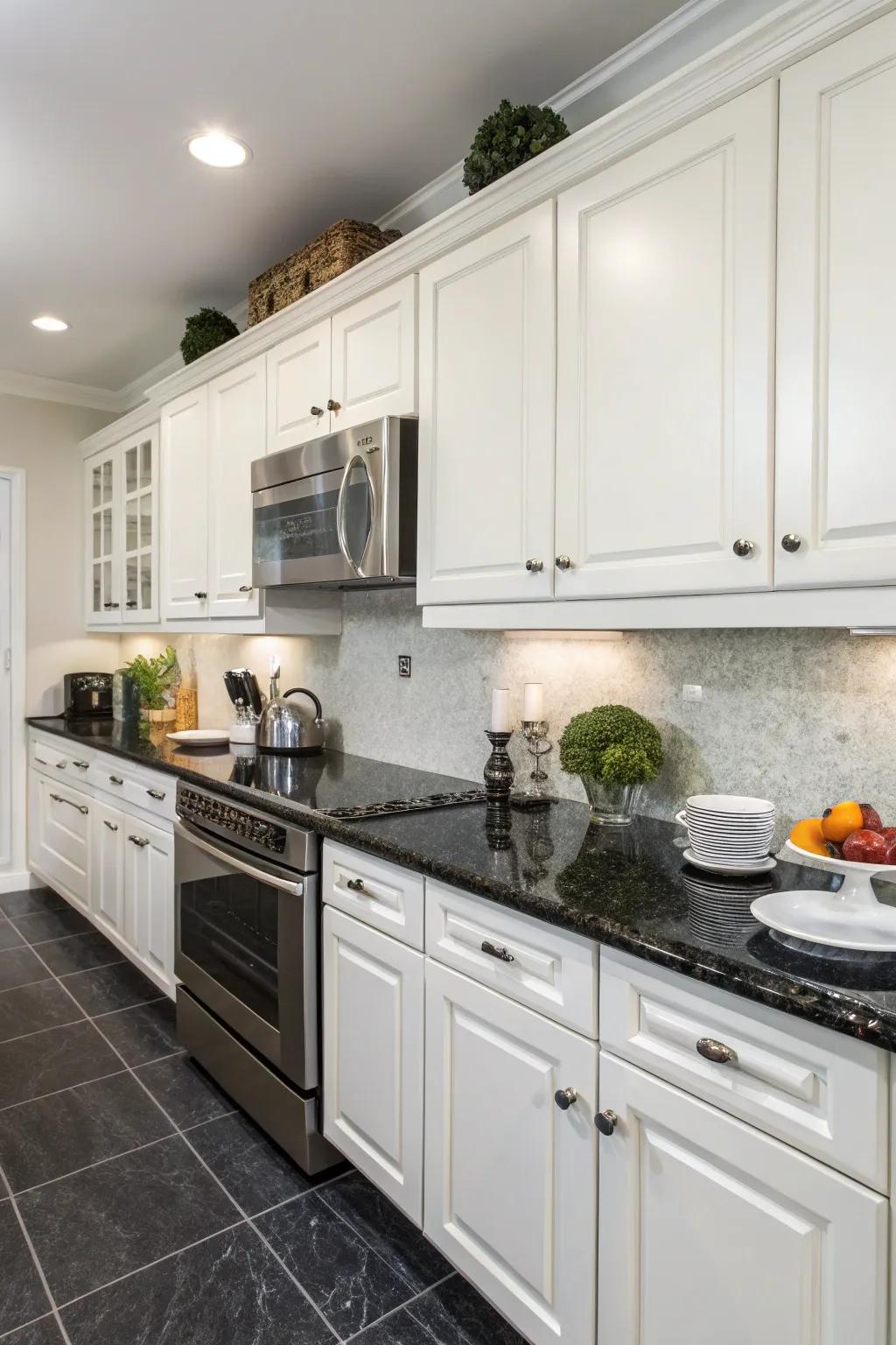 White cabinets are made all the more dramatic when paired with dark countertops.