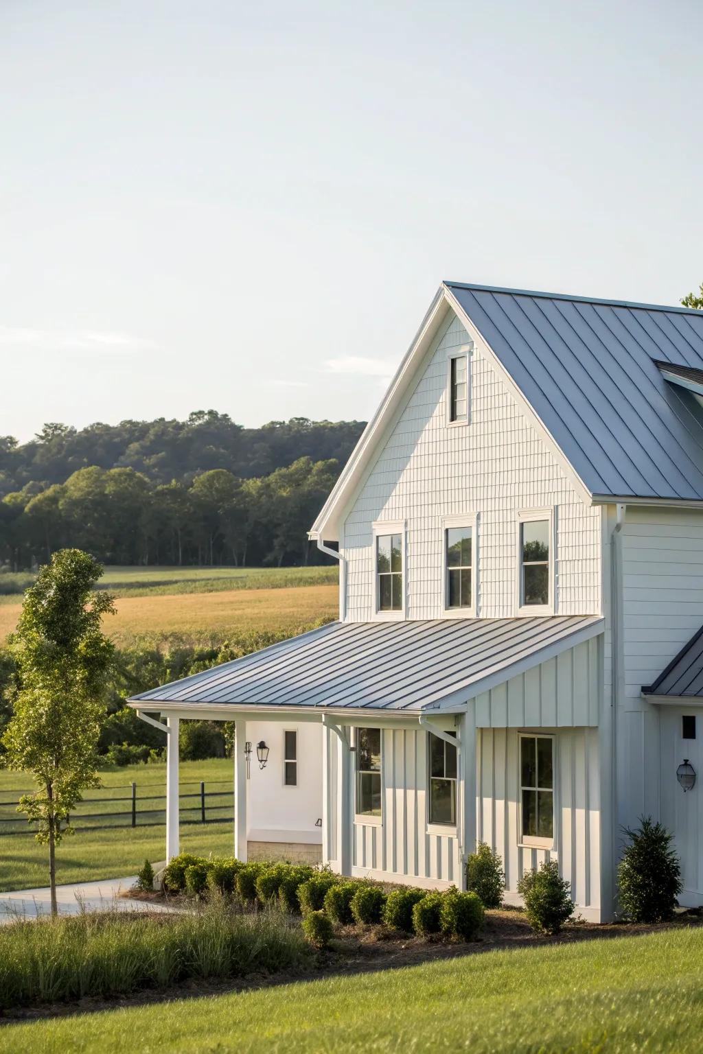 A modern farmhouse featuring white panelling and a polished metal covering.