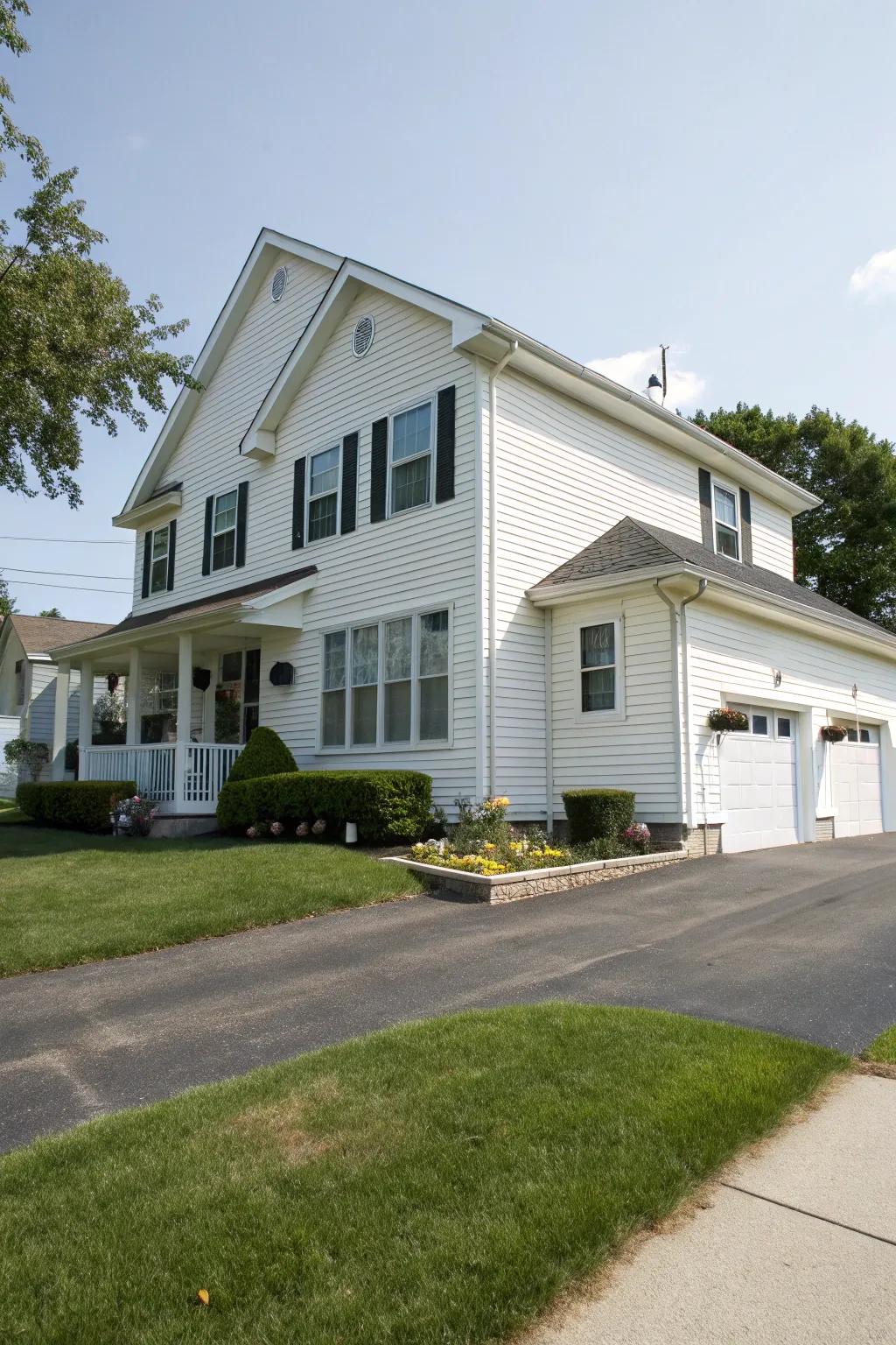 A grand two-story house featuring white panelling.