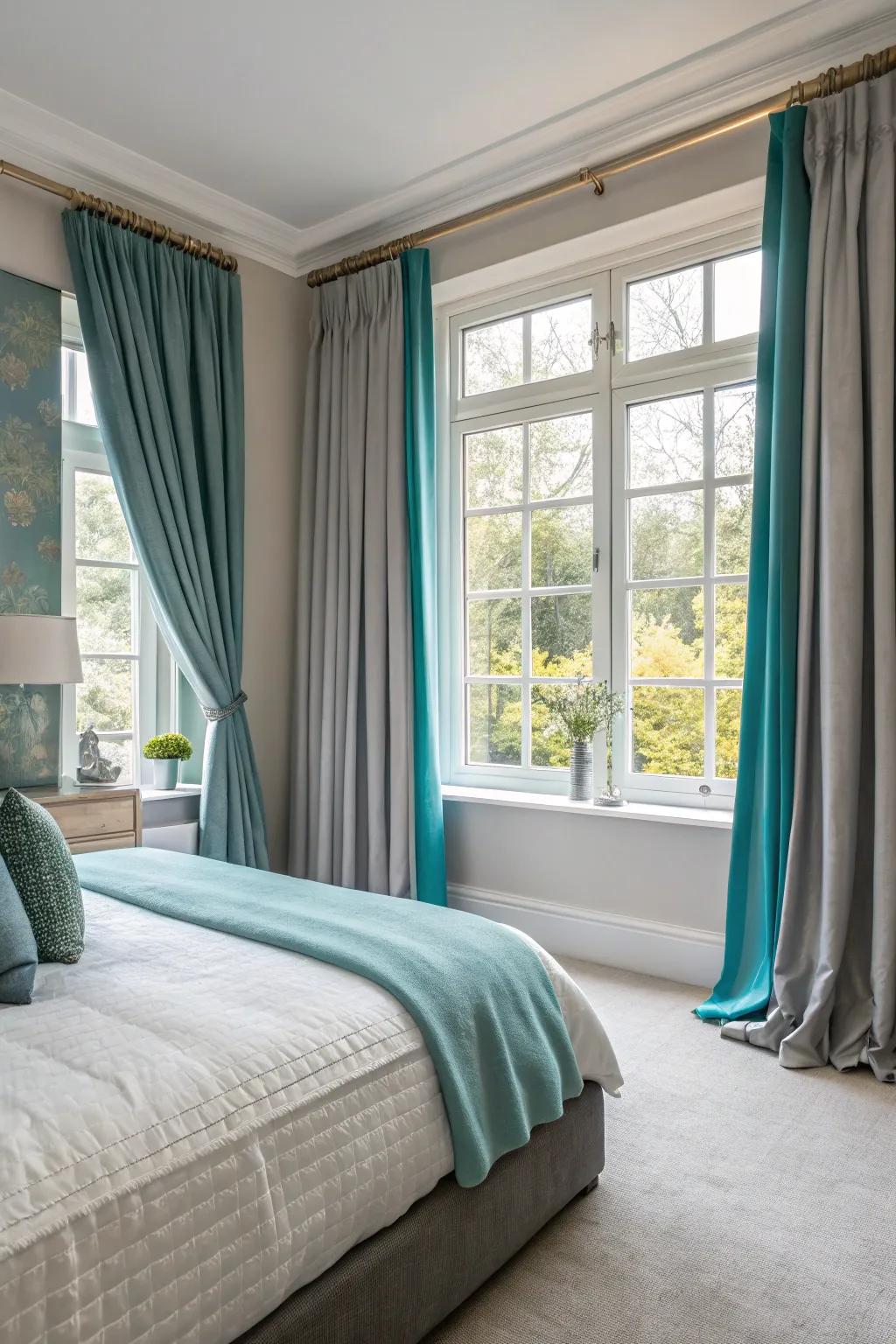 Window treatments in grey and teal finish the room's look.
