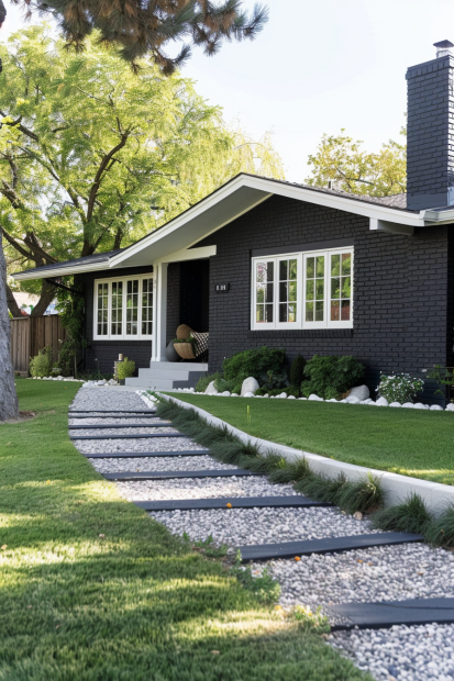 Mid-century black brick ranch with white windows