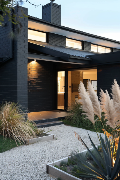 Modern black brick home with desert landscaping
