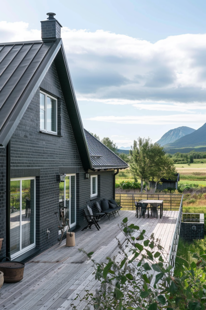 Black brick home with deck and mountain views