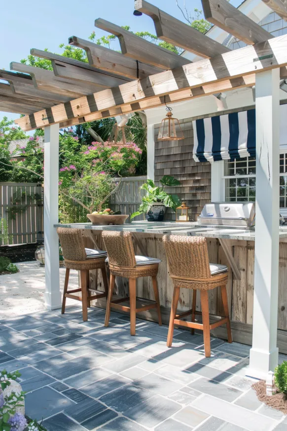 Outdoor bar with pergola and wicker stools