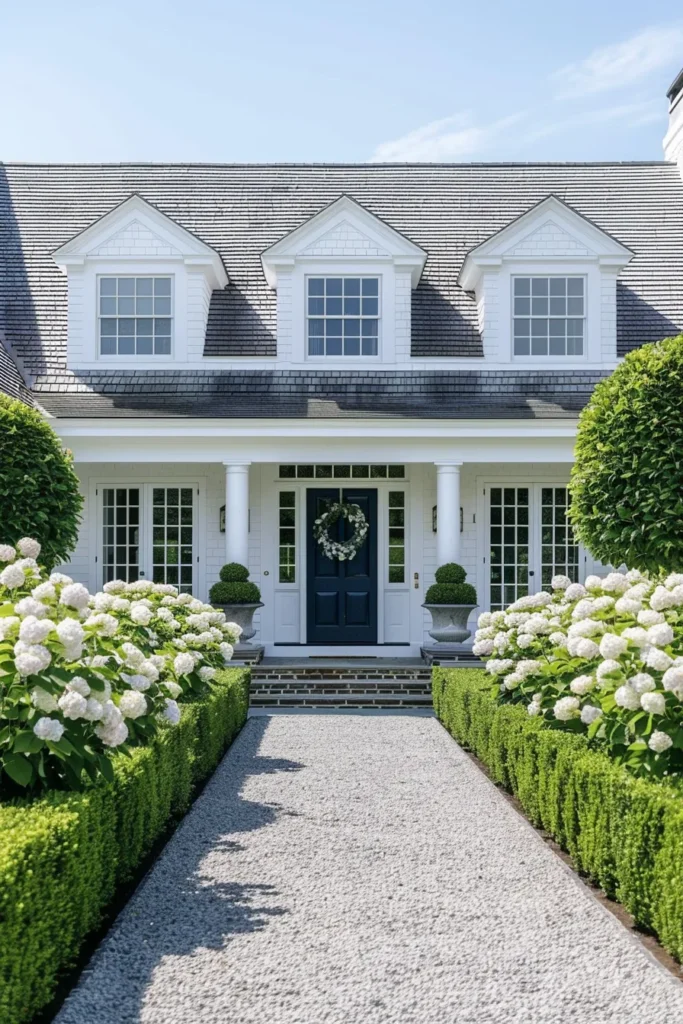 Cape Cod home with hydrangea-lined walkway