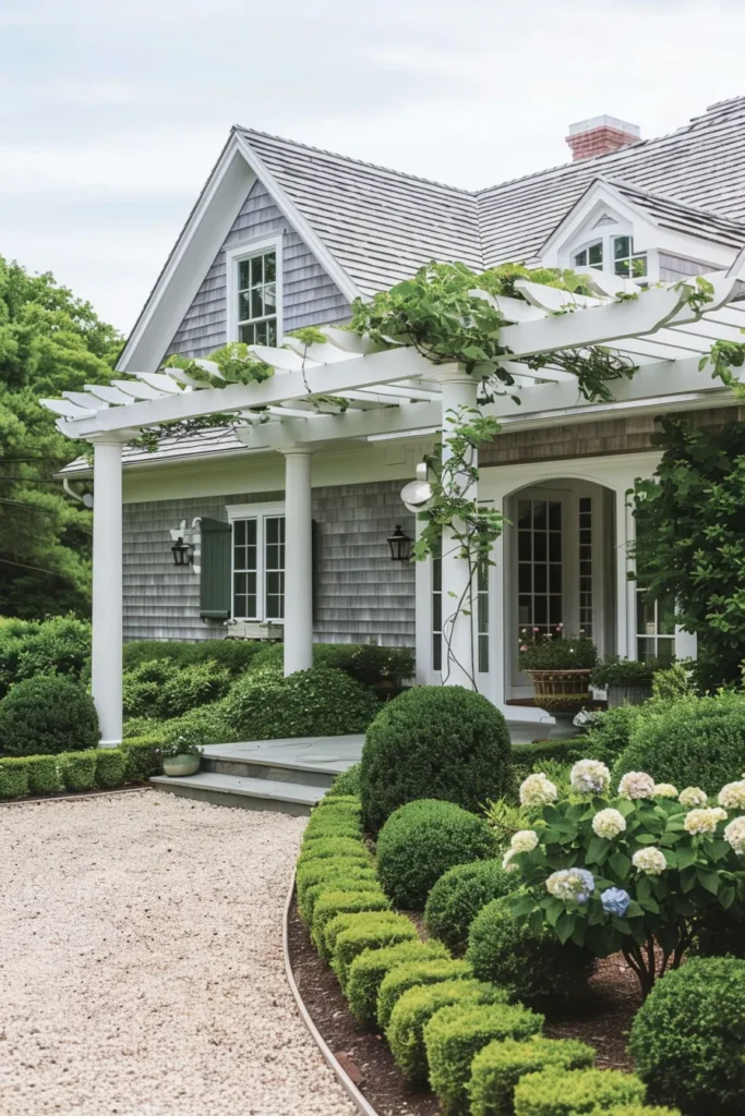 Cape Cod home with lush green entrance