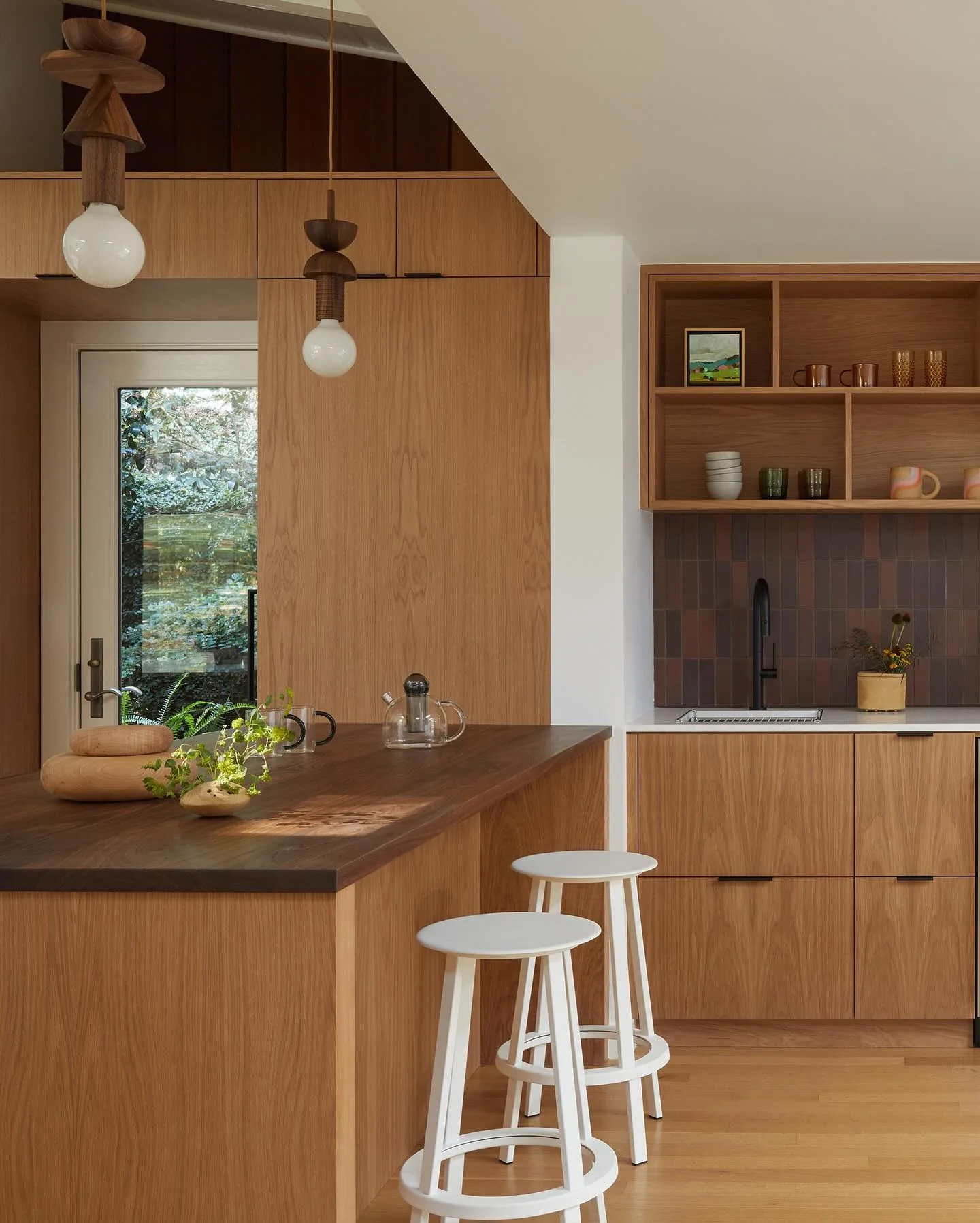 Scandinavian kitchen with rich wood and white accents